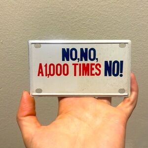 No, No, a 1,000 Times No metal sign